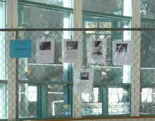 "Portraying Poverty": Photos and accompanying descriptions displayed on chain link fence, F08